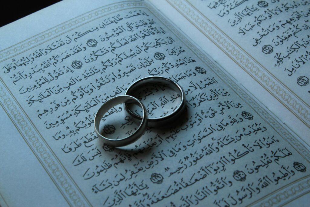 Wedding rings on a Quran